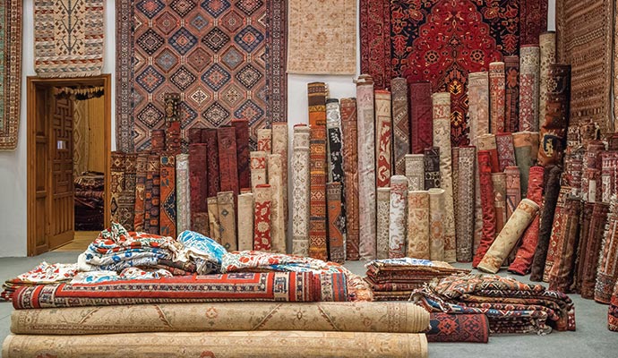 Different types of rugs stored in a rug storage