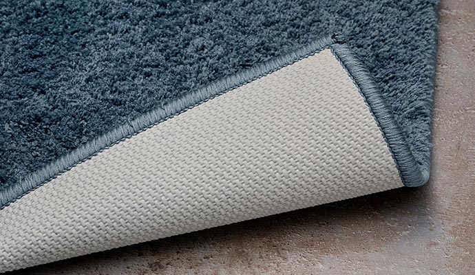 Backing repaired rug