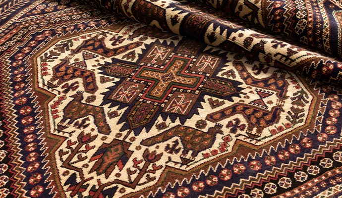 Hand-woven oriental rug with bird patterns