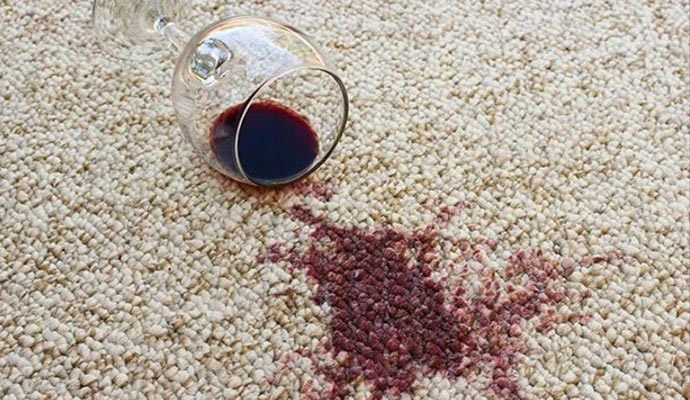 Red wine spill on light carpet