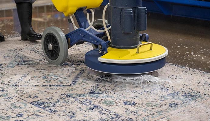 Rug cleaning with a machine
