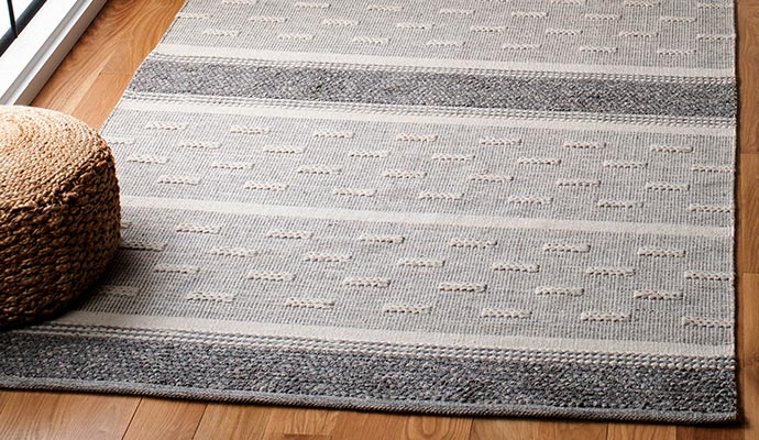 Cotton rug on wooden floor