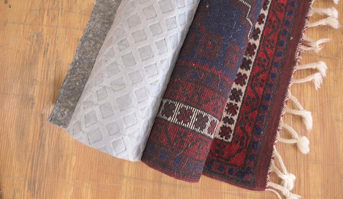 Rug padding on wooden floor