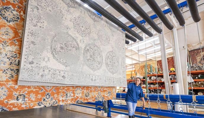 Rugs hanging in professional drying facility