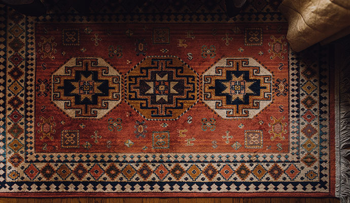 A rug with heavy burn and discoloration