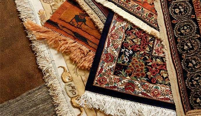 Stacked oriental Persian rugs with intricate patterns