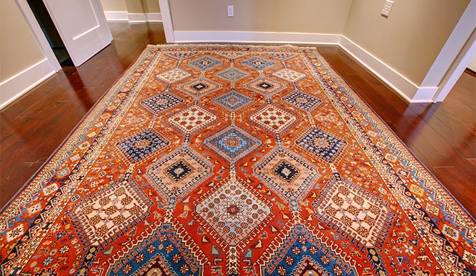Tribal oriental rug on hardwood floor